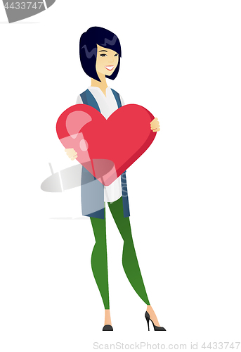 Image of Asian business woman holding a big red heart.