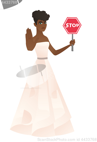 Image of African-american fiancee holding stop road sign.