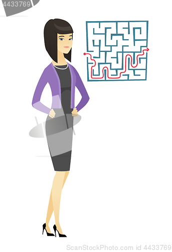 Image of Business woman looking at labyrinth with solution