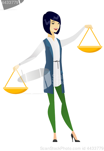 Image of Asian business woman holding balance scale.