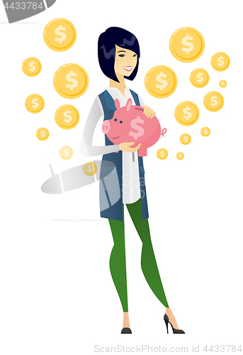 Image of Asian business woman holding a piggy bank.