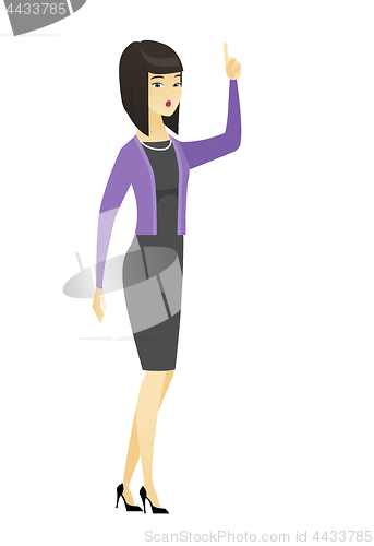 Image of Business woman with open mouth pointing finger up.