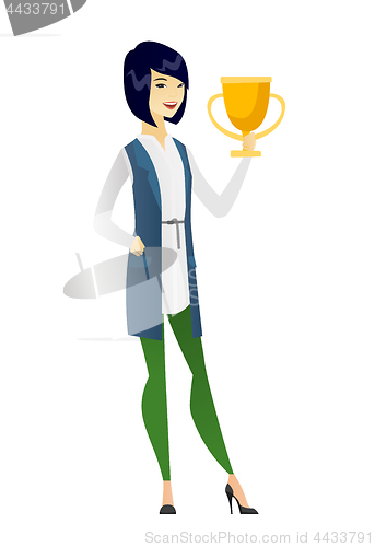 Image of Asian business woman holding a trophy.