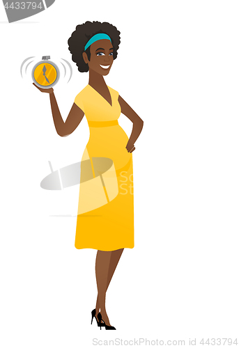 Image of African pregnant woman holding alarm clock.