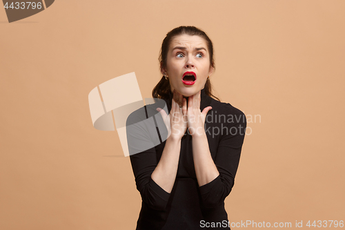 Image of Young woman overwhelmed with a pain in the throat