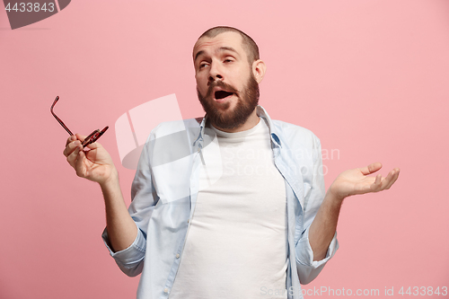 Image of Beautiful bored man bored isolated on pink background