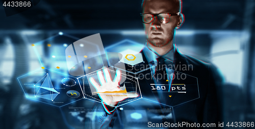 Image of close up of businessman touching virtual screen