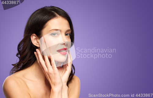 Image of beautiful young woman with red lipstick