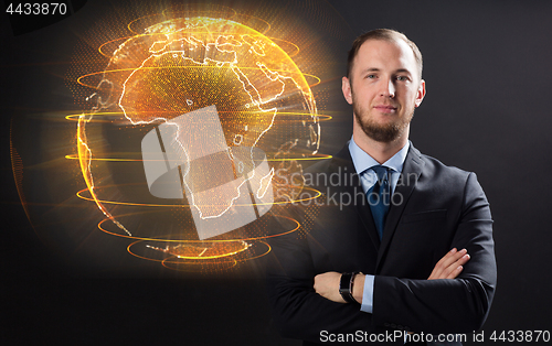 Image of close up of businessman with earth hologram