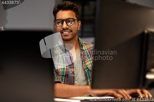 Image of close up of creative man working at night office