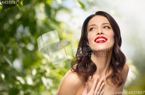 Image of beautiful smiling young woman with red lipstick