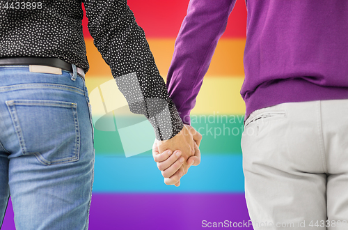 Image of close up of male gay couple holding hands