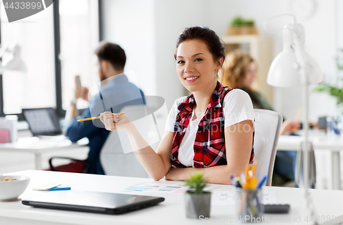 Image of creative woman working on user interface at office