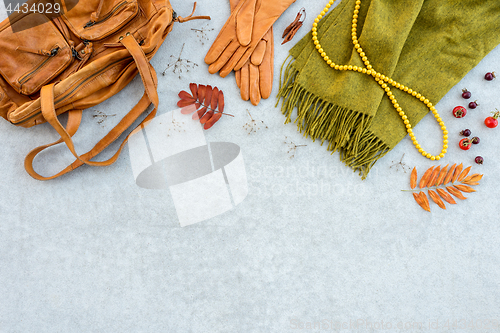 Image of Autumn fashion flat lay in orange and green tones