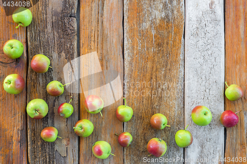 Image of Apples on rustic wooden background with copy space