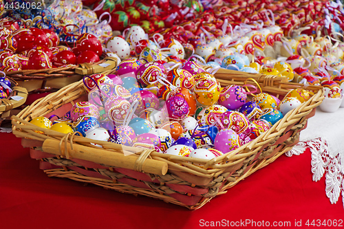 Image of Easter eggs in a knit wooden basket