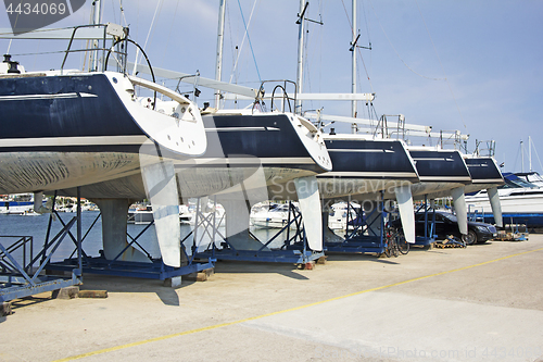 Image of Luxury yachts at shipyard waiting for maintenance and repair