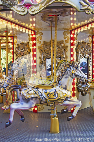 Image of Old fashioned french carousel with horses