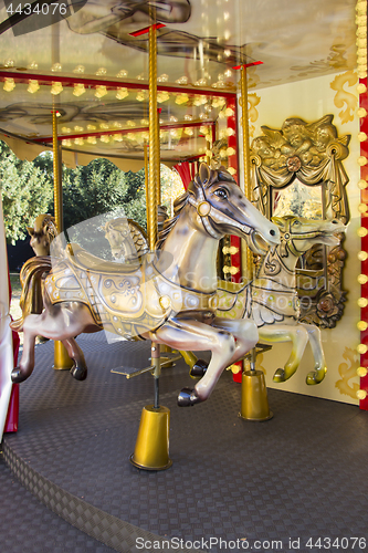 Image of Old fashioned french carousel with horses
