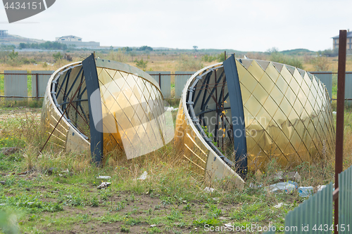 Image of Parts of the church domes brought for the construction of the church lie on the ground