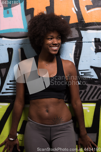 Image of black woman after a workout at the gym