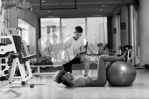 Image of pilates  workout with personal trainer at gym