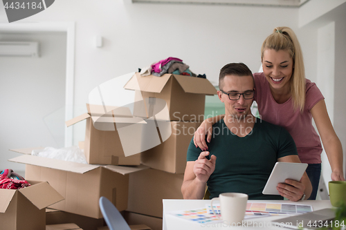 Image of Young couple moving in a new home