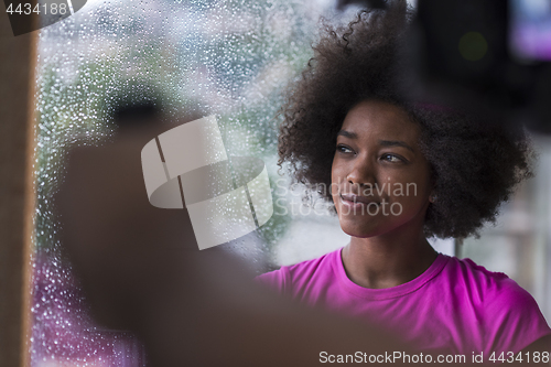 Image of african american woman using tablet