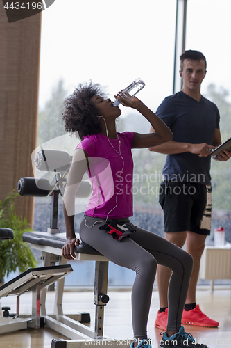 Image of couple in a gym have break