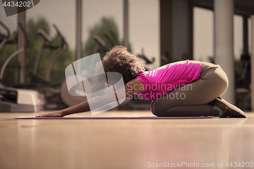 Image of african american woman exercise yoga in gym