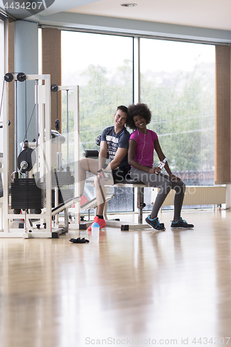 Image of couple in a gym have break