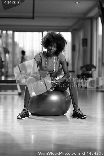 Image of woman  relaxing after pilates workout