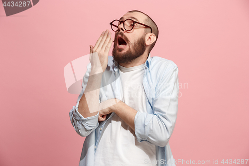 Image of Beautiful bored man bored isolated on pink background