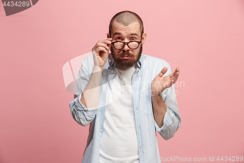 Image of Beautiful bored man bored isolated on pink background