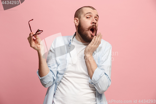 Image of Beautiful bored man bored isolated on pink background