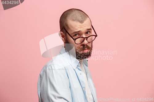 Image of Beautiful man looking suprised and bewildered isolated on pink