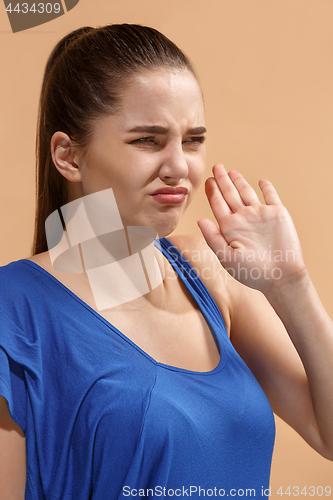 Image of Let me think. Doubtful pensive woman with thoughtful expression making choice against pastel background