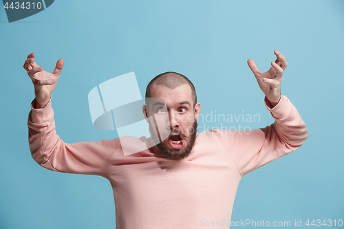 Image of Handsome man in stress isolated on blue