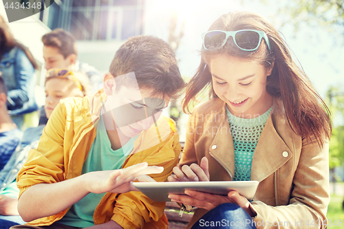Image of group of students with tablet pc at school yard