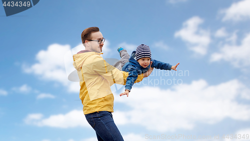 Image of father with son playing and having fun outdoors