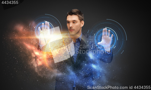 Image of businessman with virtual planet and space hologram