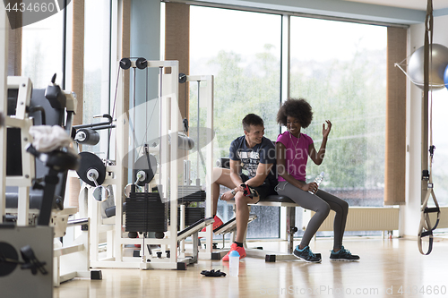 Image of couple in a gym have break