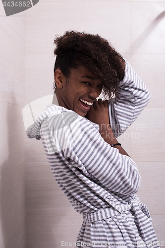 Image of beautiful black woman wearing  bathrobe