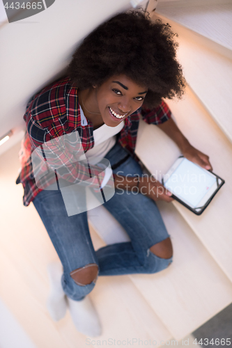 Image of black woman using her electronic tablet