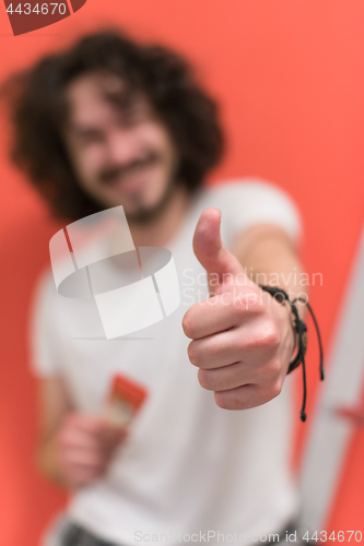 Image of man with funny hair over color background with brush