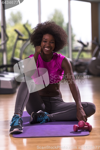 Image of african american woman exercise yoga in gym