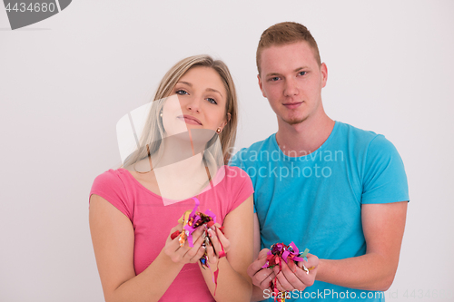 Image of romantic young  couple celebrating  party with confetti