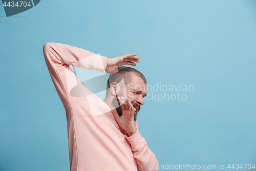 Image of Portrait of the scared man on blue
