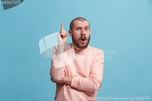 Image of Young serious thoughtful businessman. Doubt concept.