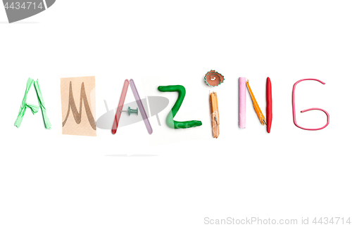 Image of The word amazing created from office stationery.